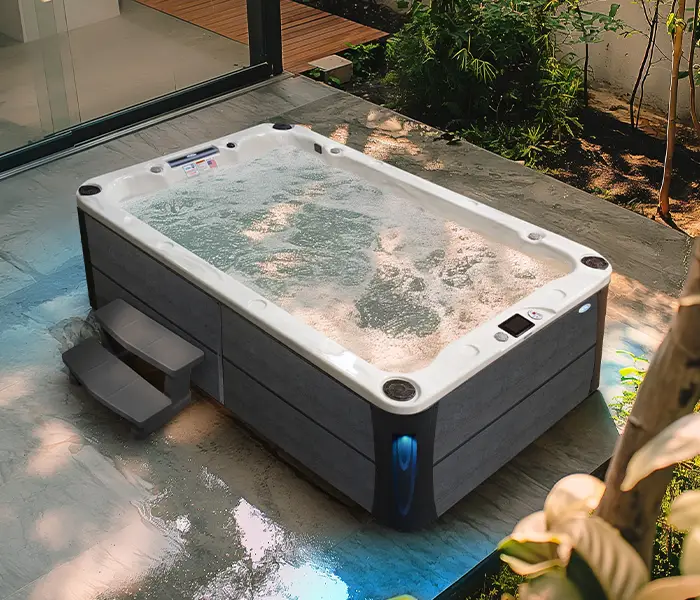 Hot Tubs, Spas, Portable Spas, Swim Spas for Sale Hot Tubs, Spas, Portable Spas, Swim Spas for Sale Calspas hot tub being used in a family setting
